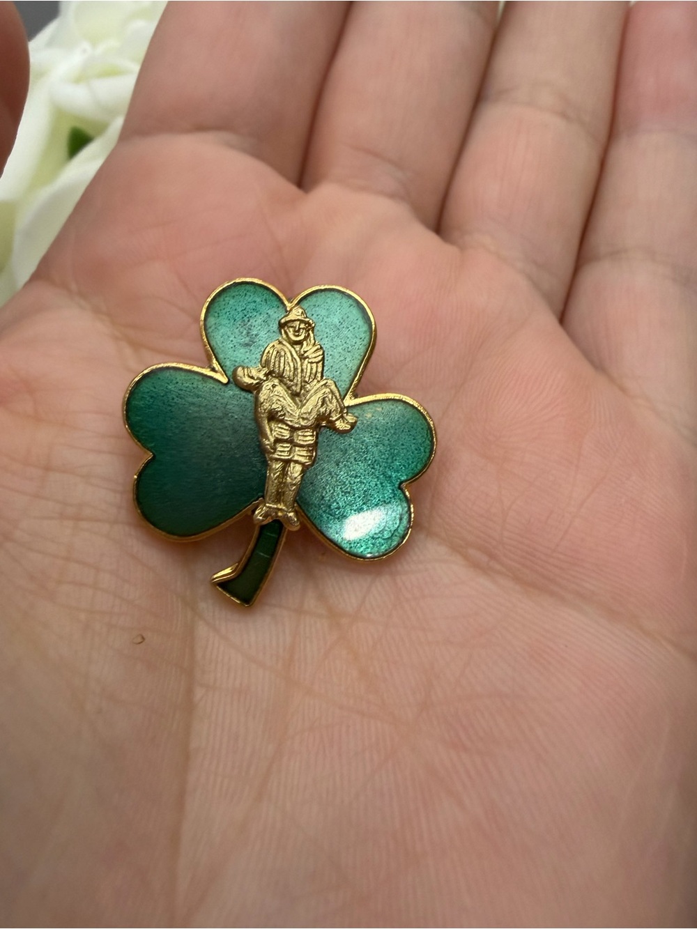 Vintage Green Shamrock Enamel Pin with Gold-tone Rescue Figure